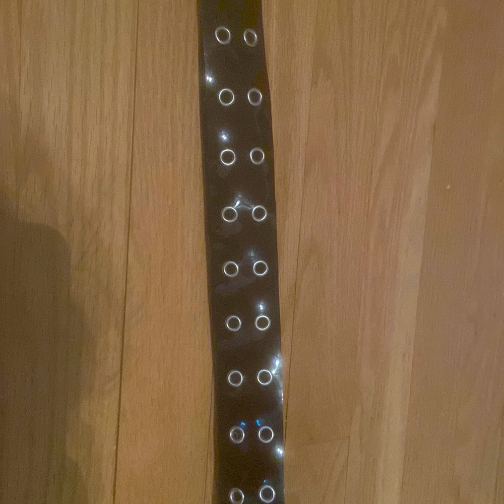 Black belt with silver holes.